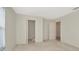 Neutral bedroom with closet and entry to the hallway at 8013 Savannah Sunset Ln, Tampa, FL 33615