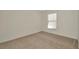 Bedroom with carpet flooring and natural lighting at 8013 Savannah Sunset Ln, Tampa, FL 33615