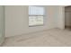 A clean bedroom with natural light entering from the window at 8013 Savannah Sunset Ln, Tampa, FL 33615