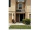 Charming townhome with neutral paint, attached garage, and inviting front entrance at 8013 Savannah Sunset Ln, Tampa, FL 33615