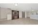 Spacious living room featuring tile flooring and a built-in bookshelf at 8013 Savannah Sunset Ln, Tampa, FL 33615