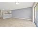 Living Room with neutral walls, tile floors, and access to a sliding glass door at 8013 Savannah Sunset Ln, Tampa, FL 33615