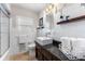 Bathroom featuring a shower/tub combo, sleek sink, and decorative accents at 807 W Braddock St, Tampa, FL 33603