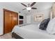 Cozy bedroom with ceiling fan, TV, wood closet and neutral decor at 807 W Braddock St, Tampa, FL 33603