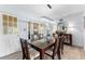 Dining room with modern light fixture, decorative mirror, and access to the patio at 807 W Braddock St, Tampa, FL 33603