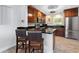 Modern kitchen with stainless steel appliances, granite countertops, and a convenient breakfast bar at 807 W Braddock St, Tampa, FL 33603