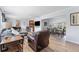 Open-concept living area with wood floors, a piano, and a dining space, great for entertaining at 807 W Braddock St, Tampa, FL 33603