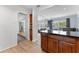 View of open floor plan into the living room with wood floors and natural light at 807 W Braddock St, Tampa, FL 33603