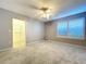 Carpeted bedroom with a ceiling fan, closet, and a window with shutters at 810 Island Walk Dr # 810, Tampa, FL 33602