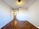Bedroom featuring laminate wood flooring, neutral color walls and bathroom access at 810 Island Walk Dr # 810, Tampa, FL 33602