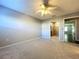 Carpeted bedroom with ceiling fan and access to the Primary bathroom at 810 Island Walk Dr # 810, Tampa, FL 33602