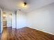 Bedroom featuring laminate wood flooring, neutral color walls and bathroom access at 810 Island Walk Dr # 810, Tampa, FL 33602