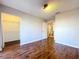 Bedroom with laminate wood flooring, closet and bathroom access at 810 Island Walk Dr # 810, Tampa, FL 33602