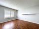 Bedroom featuring hardwood floors and plantation shutters, perfect for natural light at 810 Island Walk Dr # 810, Tampa, FL 33602