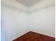 View of the closet with laminate floors and wire shelving system at 810 Island Walk Dr # 810, Tampa, FL 33602