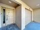 Home entrance featuring a sturdy front door, a garage door, and a well-maintained exterior at 810 Island Walk Dr # 810, Tampa, FL 33602