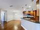 Kitchen with wooden cabinets, stone countertops, and stainless steel appliances at 810 Island Walk Dr # 810, Tampa, FL 33602