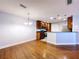 Open-concept kitchen with dark wood cabinets, stainless steel appliances, and a breakfast bar at 810 Island Walk Dr # 810, Tampa, FL 33602