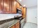 Kitchen with granite countertops, tile backsplash, and stainless steel appliances at 810 Island Walk Dr # 810, Tampa, FL 33602