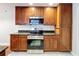Kitchen features granite countertops, wood cabinets and stainless steel appliances at 810 Island Walk Dr # 810, Tampa, FL 33602