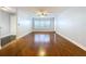Open living room boasts hardwood floors, plantation shutters, and ample space for furnishings at 810 Island Walk Dr # 810, Tampa, FL 33602