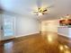 Bright living area showcases hardwood floors, recessed lights, and an open layout connecting to the kitchen at 810 Island Walk Dr # 810, Tampa, FL 33602