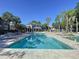 Beautiful community pool area with ample lounge chairs and tropical landscaping at 810 Island Walk Dr # 810, Tampa, FL 33602