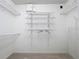 Bright walk-in closet equipped with an efficient wire shelving system at 810 Island Walk Dr # 810, Tampa, FL 33602