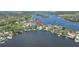 An aerial view of the property with beautiful waterfront access at 915 Bayshore Dr, Tarpon Springs, FL 34689