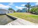 The backyard features a lawn and a dock at 915 Bayshore Dr, Tarpon Springs, FL 34689