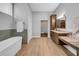 Large bathroom with a walk-in shower, free standing tub, and marble countertops at 915 Bayshore Dr, Tarpon Springs, FL 34689