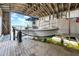 This boathouse has a boat on a lift with a view of the water at 915 Bayshore Dr, Tarpon Springs, FL 34689