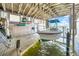 This boathouse features a boat on a lift and storage on the side at 915 Bayshore Dr, Tarpon Springs, FL 34689