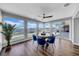 Bright dining area featuring water views, wood floors and a round table with blue velvet chairs at 915 Bayshore Dr, Tarpon Springs, FL 34689