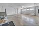 Spacious garage with painted concrete floor and walls, and an automatic door that opens to the exterior at 915 Bayshore Dr, Tarpon Springs, FL 34689