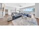 Expansive living area with a sectional sofa, pool table, and large windows offering scenic waterfront views at 915 Bayshore Dr, Tarpon Springs, FL 34689