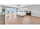Light-filled main bedroom with hardwood floors, ceiling fan, and large windows overlooking water at 915 Bayshore Dr, Tarpon Springs, FL 34689