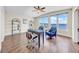 Home office with stunning water views, custom shelving, and comfortable seating, creating an inspiring workspace at 915 Bayshore Dr, Tarpon Springs, FL 34689