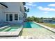 Outdoor pool and spa with waterfront view, showcasing a spacious backyard and stylish architecture at 915 Bayshore Dr, Tarpon Springs, FL 34689