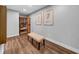 A cozy sauna room with a wooden sauna, a bench, and stylish wall art, creating a relaxing and inviting retreat at 915 Bayshore Dr, Tarpon Springs, FL 34689