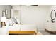 Bright bedroom with a full size bed, stylish nightstand, and modern decor at 10274 Gentle Rain Dr, Land O Lakes, FL 34638