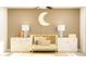 Adorable Bedroom featuring a cute moon decor, stylish crib, and ambient lamps at 10274 Gentle Rain Dr, Land O Lakes, FL 34638