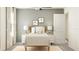 Cozy bedroom with a full size bed, modern nightstands, and neutral walls at 10274 Gentle Rain Dr, Land O Lakes, FL 34638