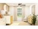 Bright Bedroom with natural light, a cozy glider, and a crib with neutral tones at 10274 Gentle Rain Dr, Land O Lakes, FL 34638