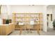 Well-organized home office featuring a modern desk, ample shelving, and stylish decor at 10274 Gentle Rain Dr, Land O Lakes, FL 34638