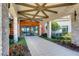 Inviting entrance with a geometric ceiling design, stone accents, and beautifully landscaped surroundings at 10555 Penny Gale Loop, San Antonio, FL 33576