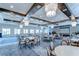 Large, elegant event space with chandeliers, round tables, and ample natural light at 10555 Penny Gale Loop, San Antonio, FL 33576