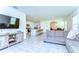 Open-concept living space featuring stylish furniture, a dining area, and a modern kitchen at 10555 Penny Gale Loop, San Antonio, FL 33576