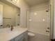 Neutral colored bathroom features a shower and bath with an updated vanity at 11834 Mile Marsh Dr, Riverview, FL 33569