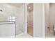 Bright bathroom showcasing a walk-in shower with white marble tiles and a peek at the walk-in closet at 11834 Mile Marsh Dr, Riverview, FL 33569